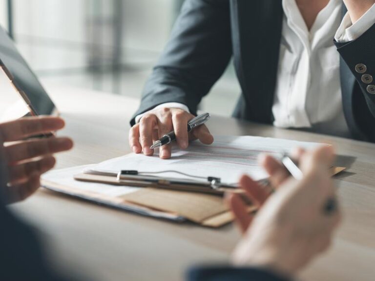 Business discussion with documents and pens