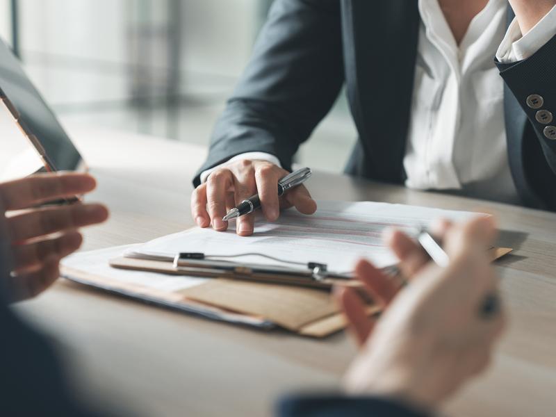 Business discussion with documents and pens