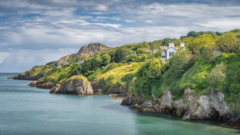 Coastal landscape with lush greenery.