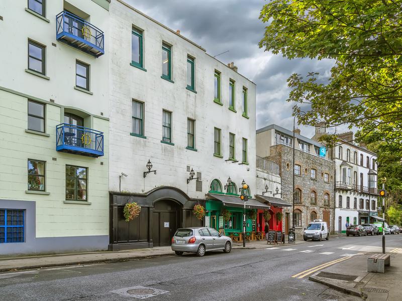 Quiet street with colorful buildings.