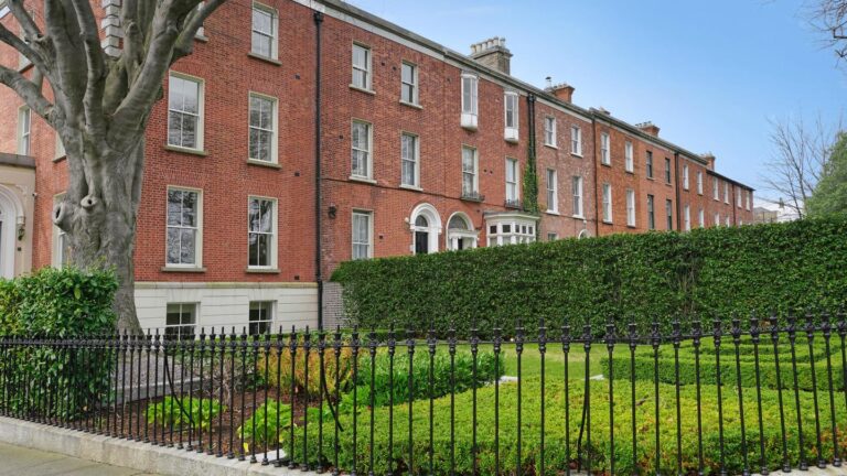 Brick building with manicured garden